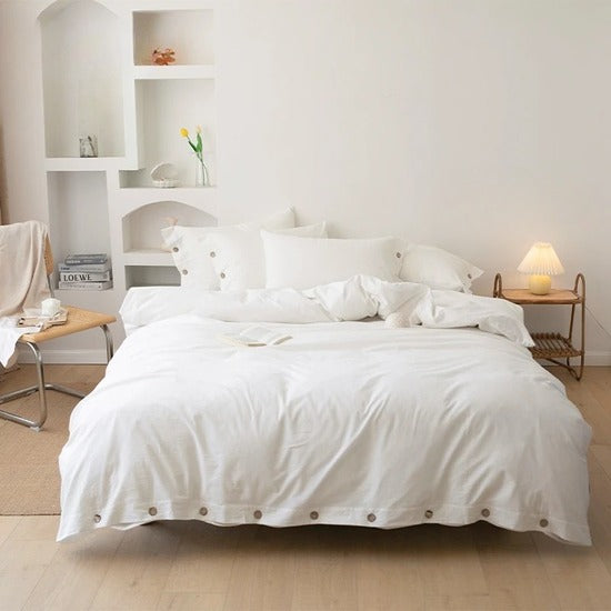 housse de couette coton blanche sur un lit
