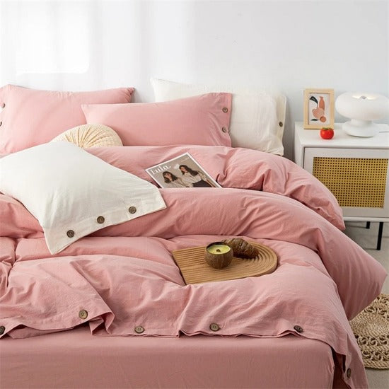 housse de couette coton vieux rose sur un lit