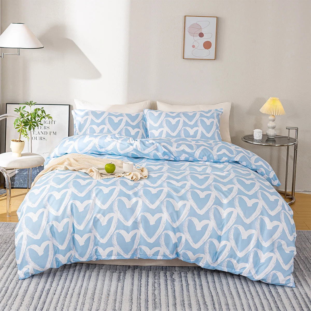 housse de couette fille motif cœur bleu sur un lit